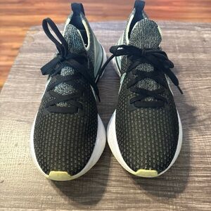 Black Knit Slip-On Athletic Sneakers with Pale Yellow Accents